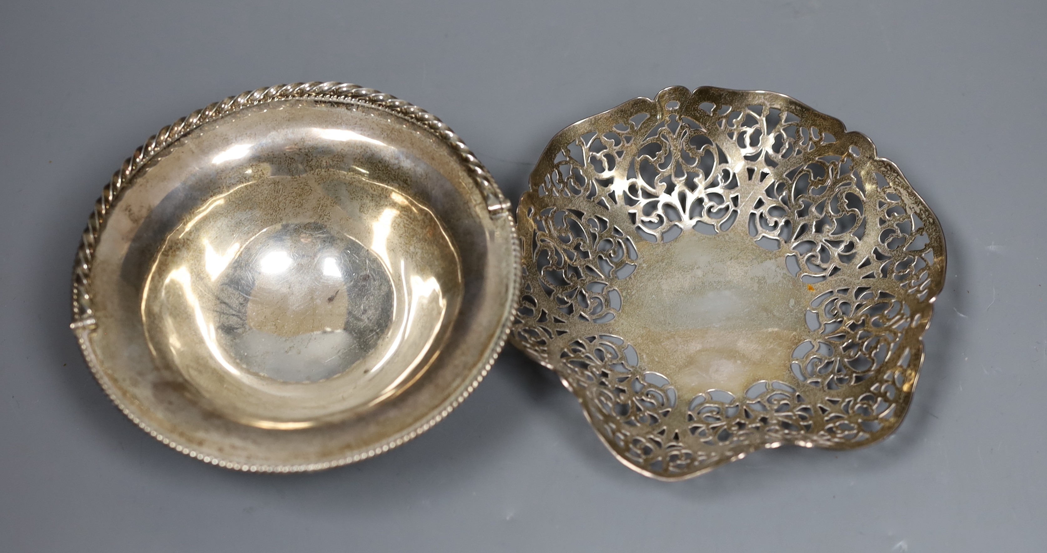 A silver bon bon dish by DRC, London, 1978, 14.1cm and a small silver bonbon basket by Rodney Clive Pettit, London, 1983, 8.3oz.